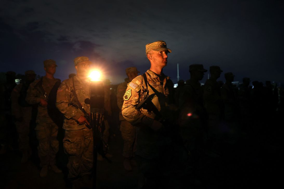 US Army trainees attend an early-morning ceremony following a grueling, 81-hour field training exercise known as the Forge on September 29, 2022, in Columbia, South Carolina.