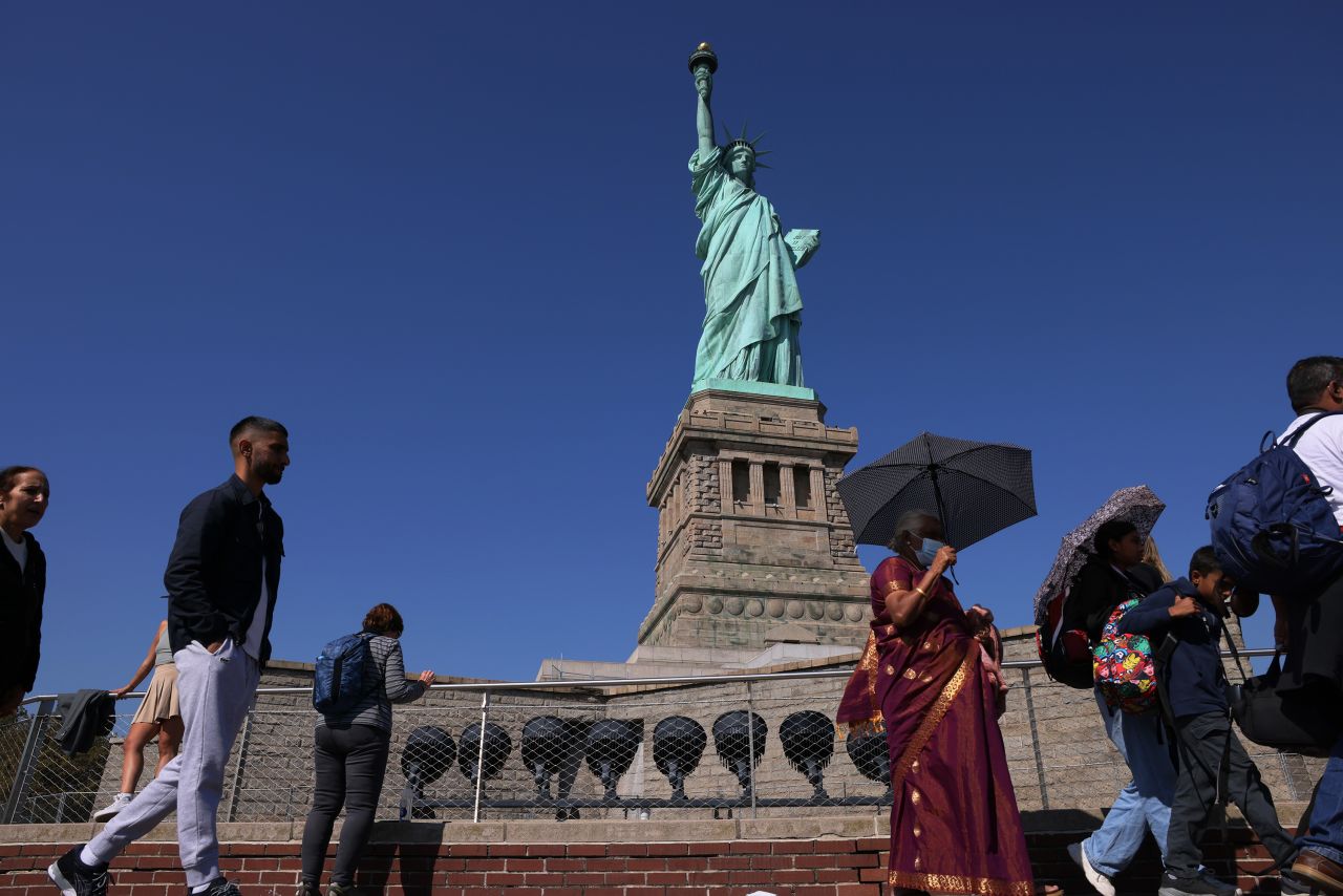 People visit the Statue of Liberty in New York in 2022.