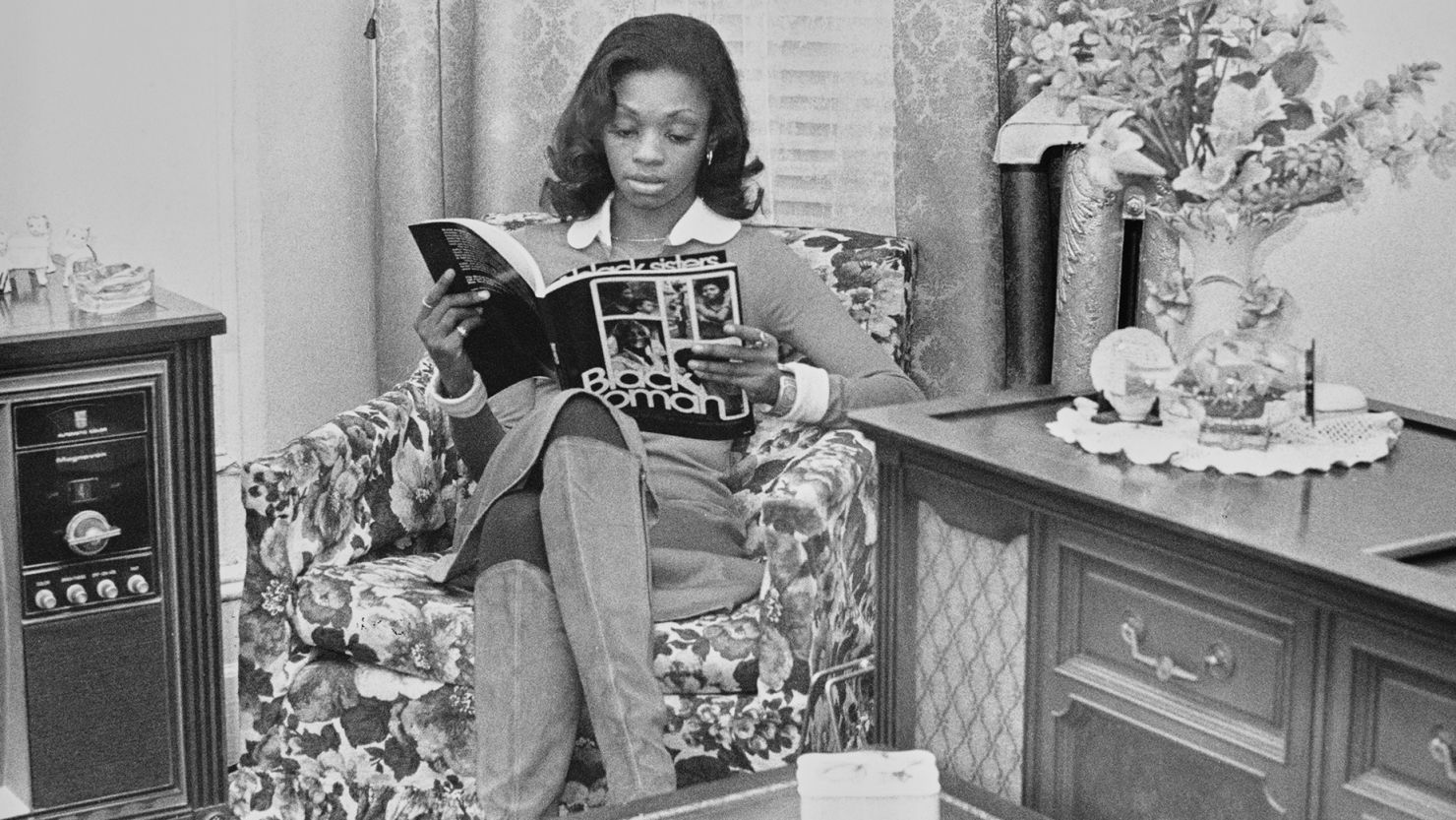 Alternative publications geared toward Black readers have long graced living room coffee tables in African American homes. A woman reads Black Woman magazine, circa 1970.