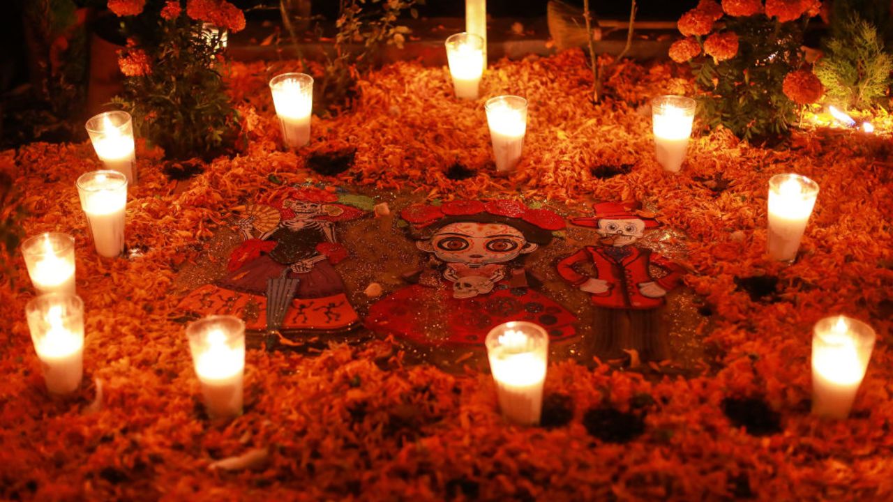 ATZOMPA, MEXICO - NOVEMBER 01: A traditional 'Dia de Muertos' offering is set up during 'Day of the Dead' celebrations on the graveyard of Atzompa on November 01, 2022 in Atzompa, Mexico. Considered one of the most popular celebrations in Mexico, the Day of the Dead takes place every year on November 1 and 2. The celebration is one of the most colorful and popular in the country; people set offerings, decorate homes and cemeteries and organize family gatherings as a tribute to the dead. (Photo by Manuel Velasquez/Getty Images)