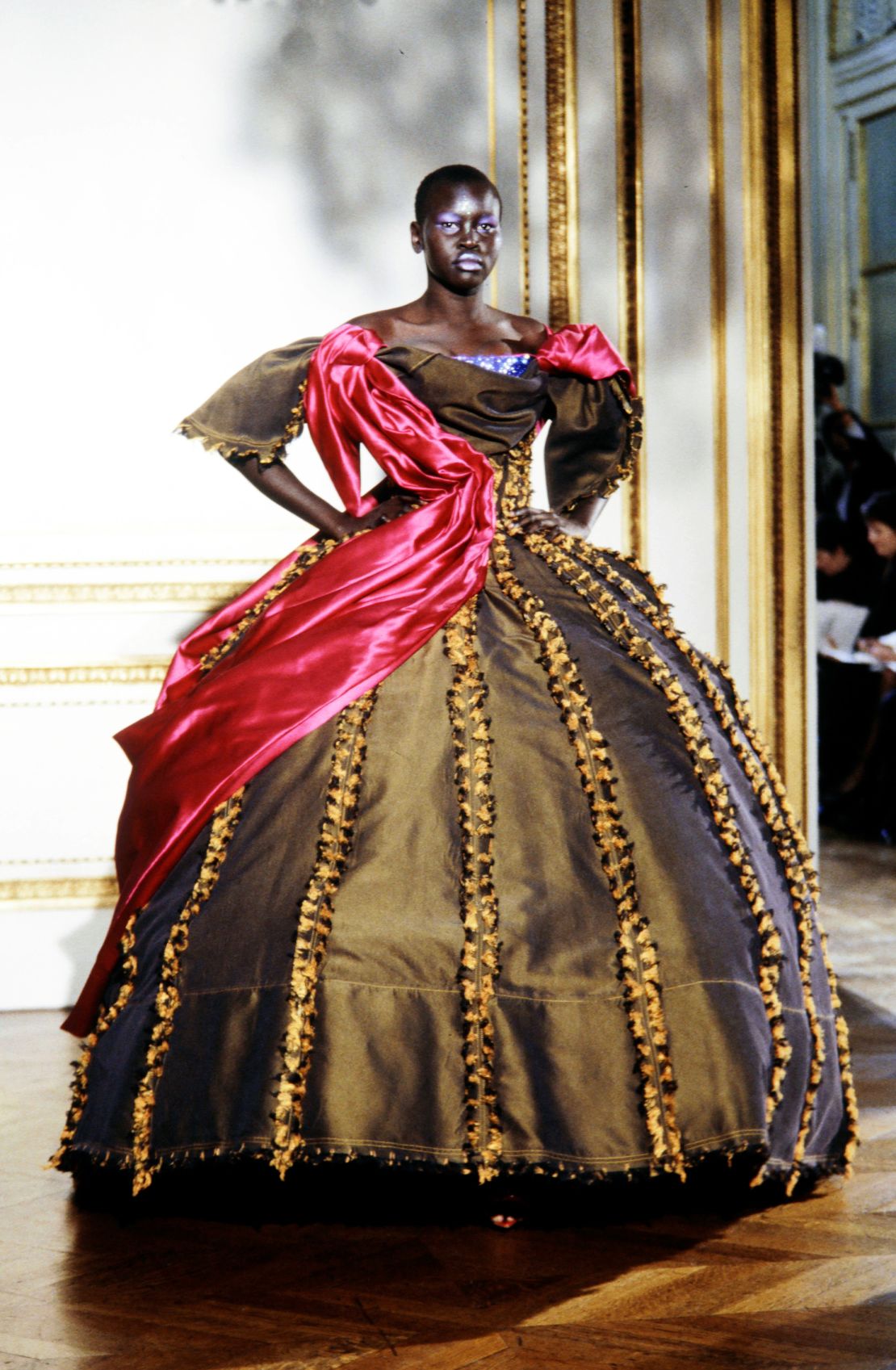 Alek Wek models a bulbous, satin ball gown at Vivienne Westwood's Spring-Spring 1998 show.
