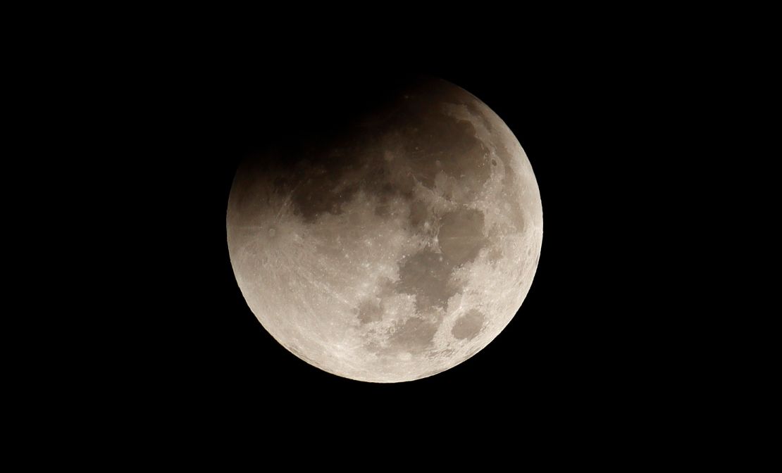 The full beaver moon begins to pass through the Earth's shadow during a total lunar eclipse in November in New York. On Saturday, a partial lunar eclipse will occur for those on the night side of Earth from 3:34 p.m. to 4:52 p.m. ET.