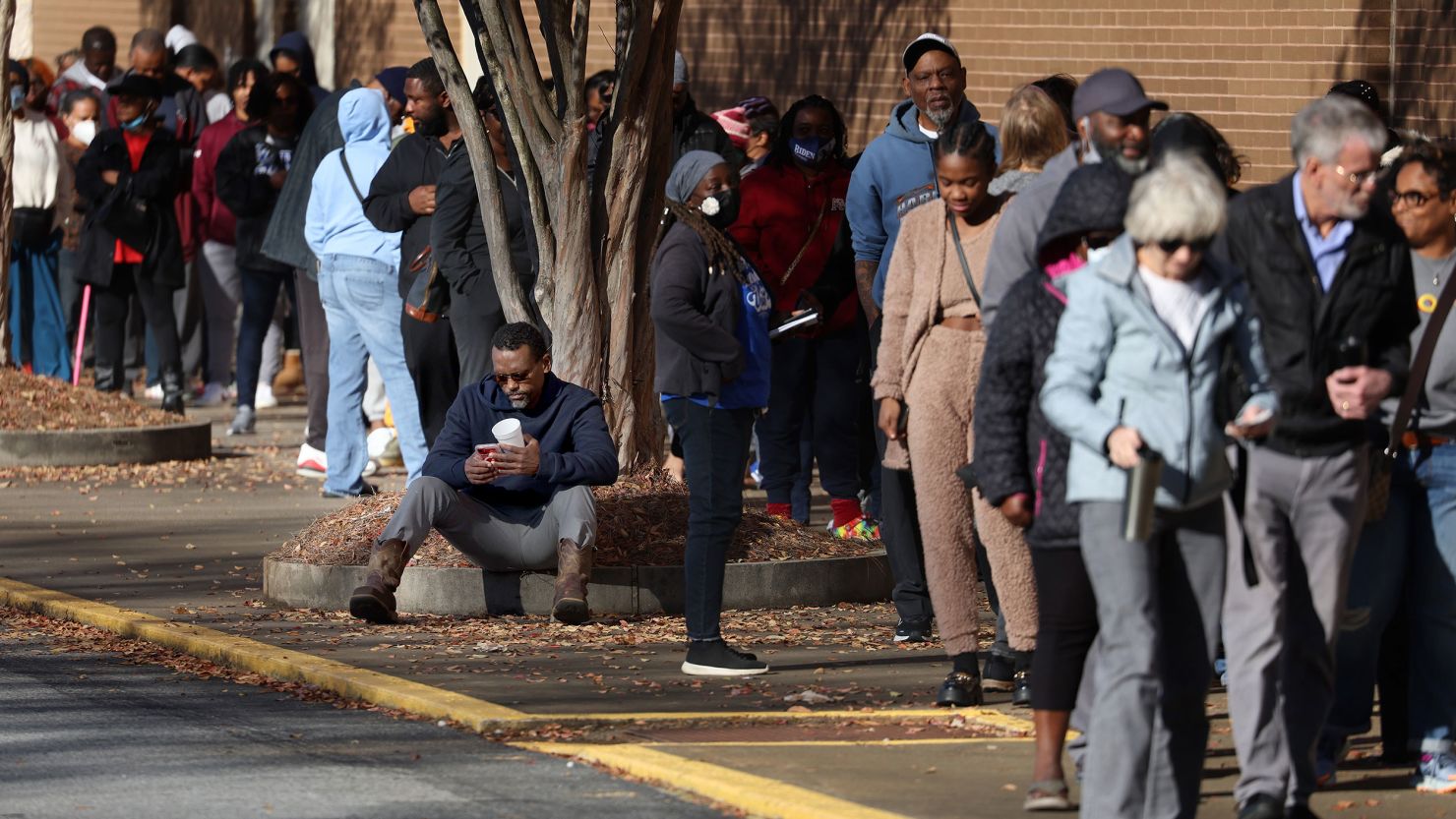 Voters line up to cast their ballots on November 26, 2022, in Decatur, Georgia.