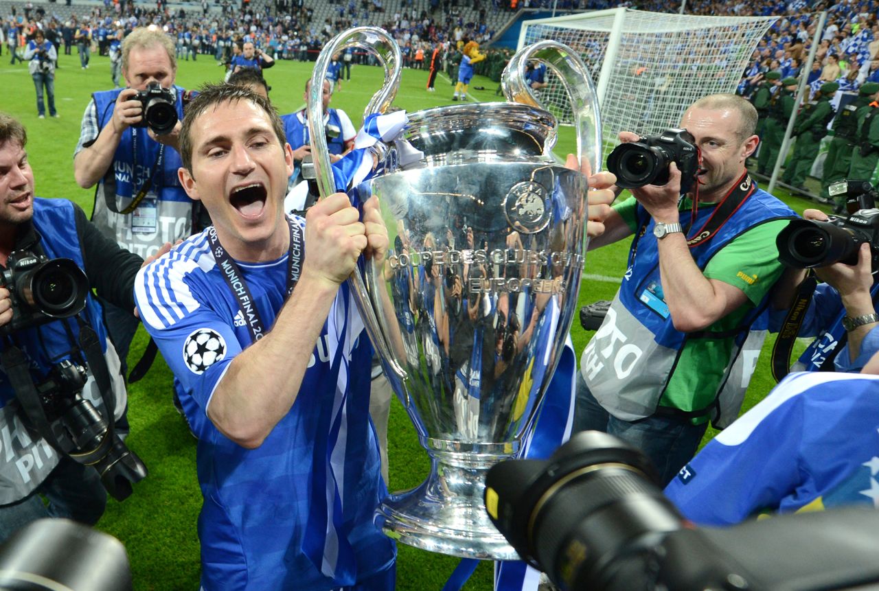 Chelsea's victorious midfielder Frank Lampard holds the trophy after the UEFA Champions League final between FC Bayern Munich and Chelsea FC on May 19, 2012.