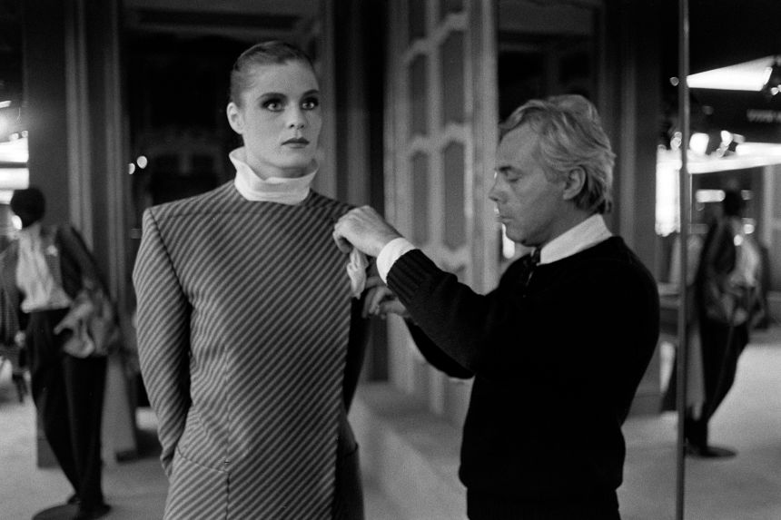 Giorgio Armani adding the finishing touches ahead of his Fall-Winter 1980 ready-to-wear collection.