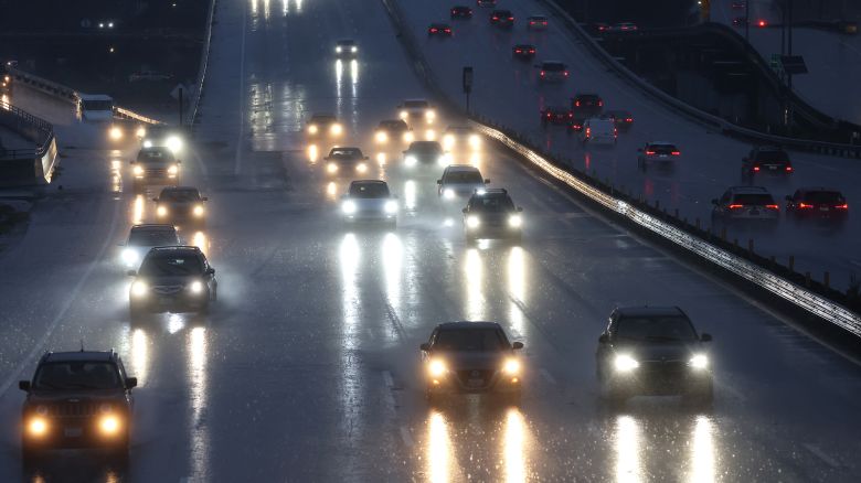 Cars drive along Highway 101 as rain falls on January 04, 2023 in Greenbrae, California.