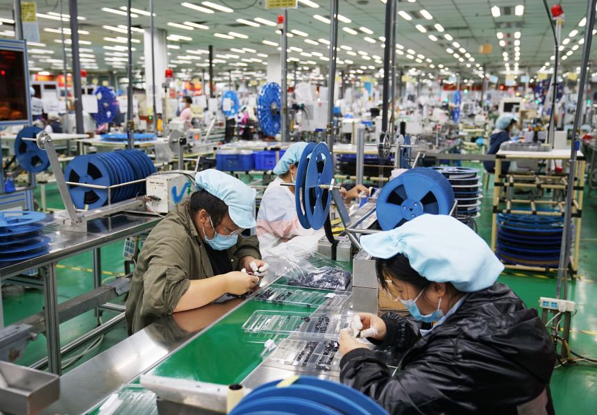 Employee work at a Foxconn factory in September 2021 in Zhengzhou, China.