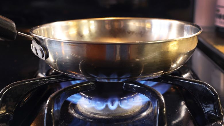CHICAGO, ILLINOIS - JANUARY 12: In this photo illustration, a pan sits on flames burning on a natural gas-burning stove on January 12, 2023 in Chicago, Illinois. Consumers and politicians have voiced concern after the commissioner of the Consumer Product Safety Commission (CPSC) recently suggested that gas stoves were a health hazard, leading people to believe that they would be banned. (Photo Illustration by Scott Olson/Getty Images)