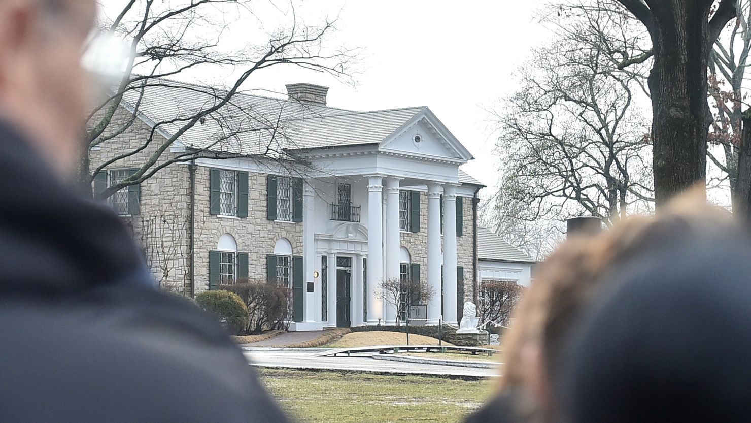 Fans gather outside Graceland to pay their respects at the memorial for Lisa Marie Presley on January 22, 2023 in Memphis, Tennessee. Last month, Elvis Presley's iconic Memphis home was nearly auctioned off by a seemingly fraudulent company.
