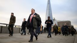LONDON, UNITED KINGDOM - JANUARY 31: The Shard is seen on the horizon as commuters cross London Bridge during the morning rush hour on January 31, 2023 in London, United Kingdom. The IMF reports that the UK economy will contract by 0.6% in 2023, as opposed to the previous prediction it might grow, and will perform worse than many other advanced economies, including Russia.The cost of living continues to hit households with grocery inflation for the first four weeks of 2023 rising to 16.7% which would add a further Â£788 per year to family food bills. (Photo by Leon Neal/Getty Images)