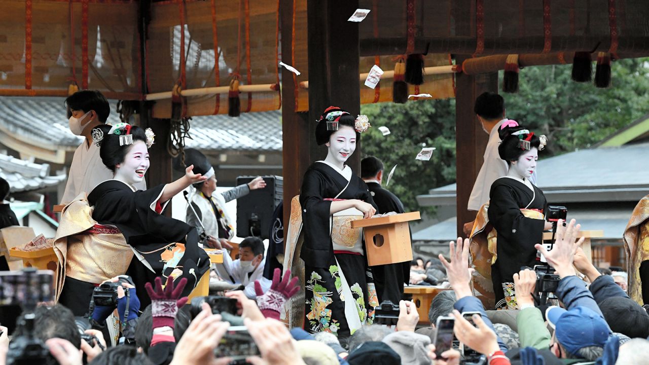 Maiko participate in a bean festival in Kyoto.