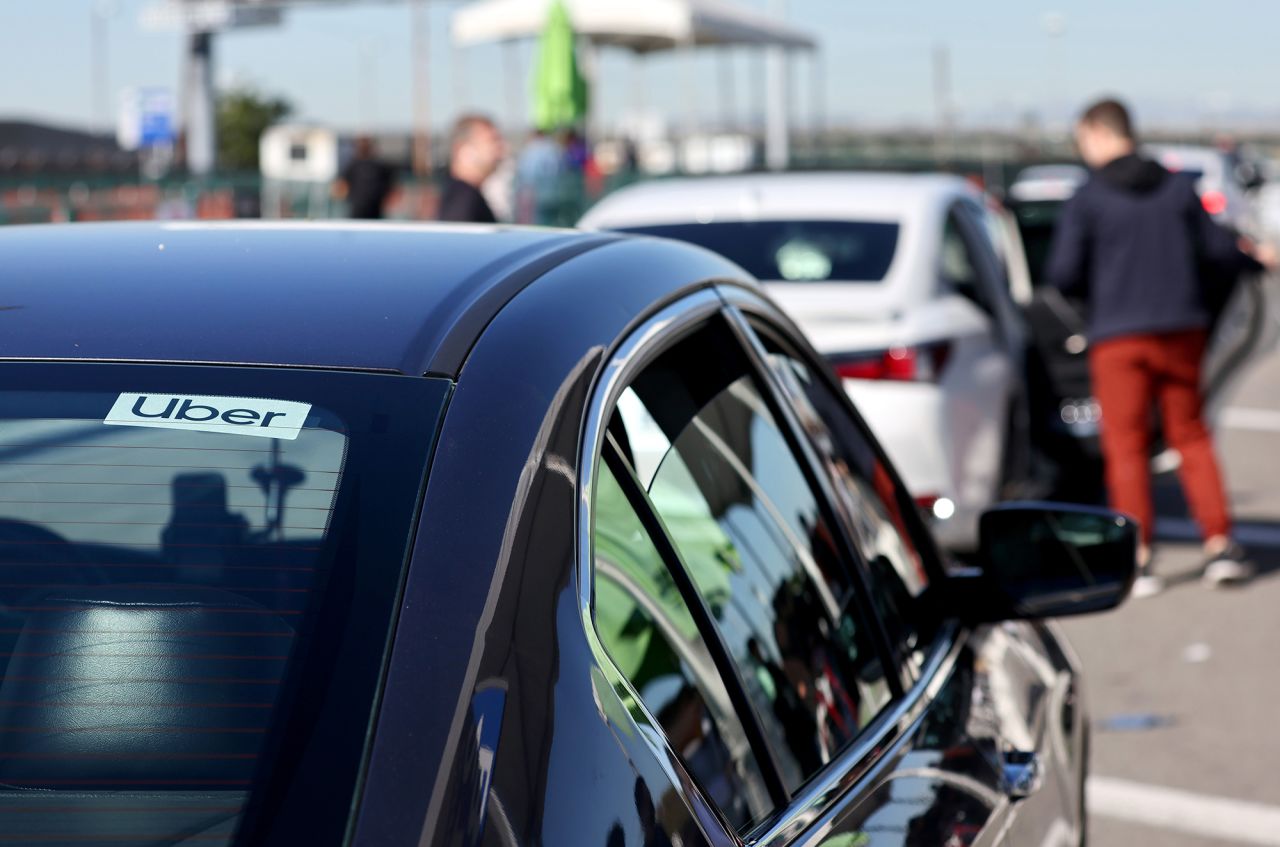 Uber rideshare vehicles are lined up to pick up passengers at Los Angeles International Airport in 2023.