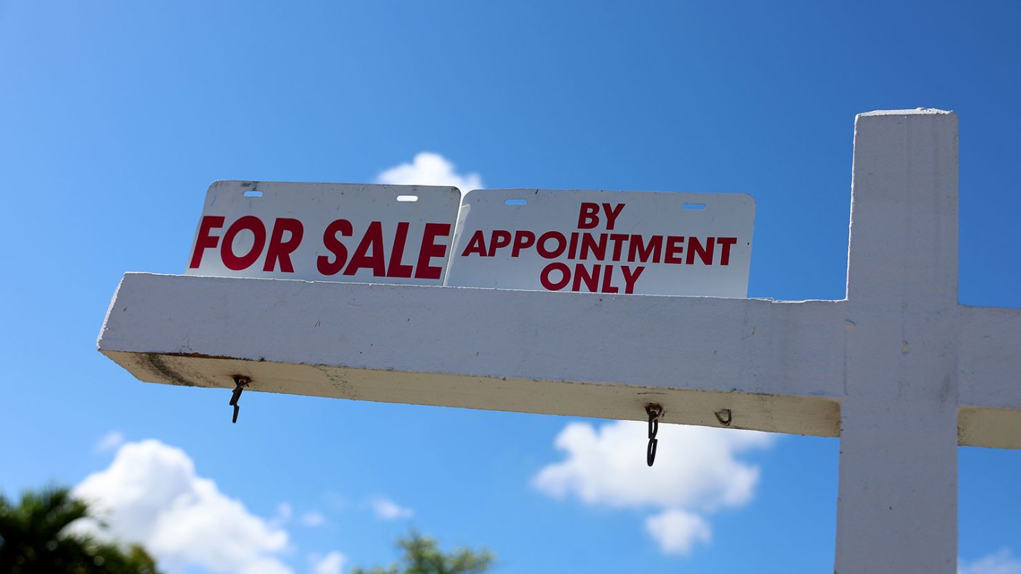 A For Sale sign displayed in front of a home on February 22, 2023 in Miami, Florida.