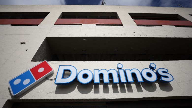 SAN FRANCISCO, CALIFORNIA - FEBRUARY 23: A sign is posted on the front of a Domino's Pizza restaurant on February 23, 2023 in San Francisco, California. Michigan-based Dominos Pizza reported fourth quarter earnings that missed analyst expectations with revenue of $1.39 billion compared to the expected $1.43 billion.  (Photo by Justin Sullivan/Getty Images)