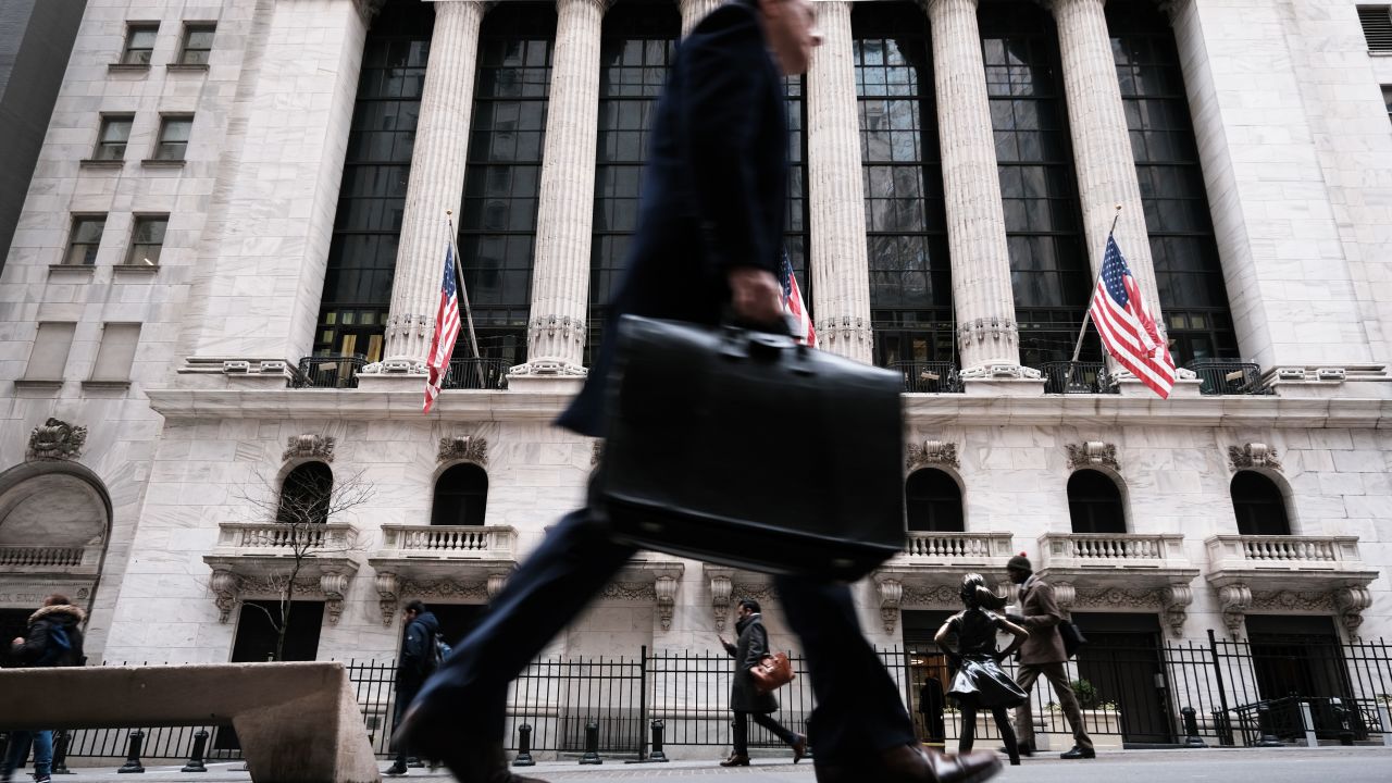 NEW YORK, NEW YORK - MARCH 16: People walk past the New York Stock Exchange (NYSE) on March 16, 2023 in New York City. Stocks fell again in morning trading as investors continue to show concerns over the stability of global banks following the collapse last week of Silicon Valley Bank.  (Photo by Spencer Platt/Getty Images)
