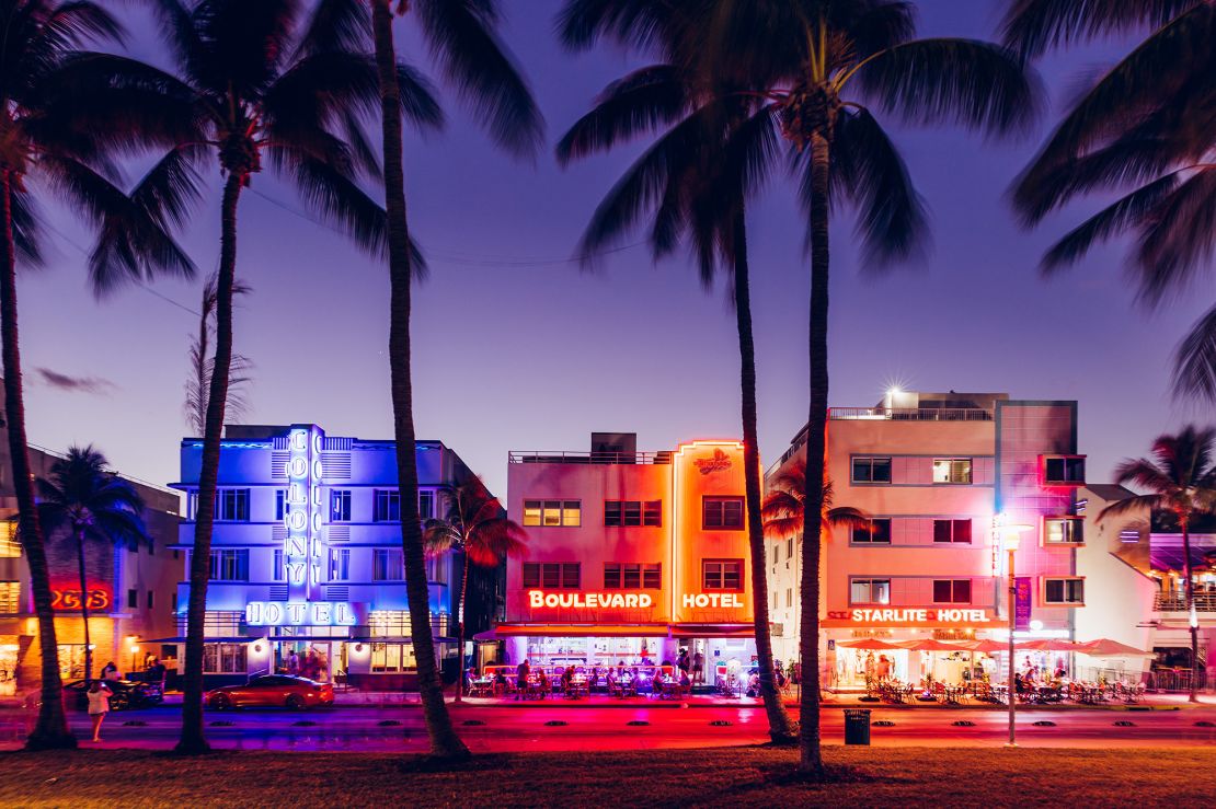 Neon lights illuminate buildings along Miami Beach's Ocean Drive.