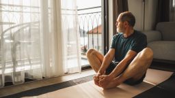 Physical activity of senior man for good health. Home workout. Wellbeing on retiree. Relaxation and rehabilitation exercises.