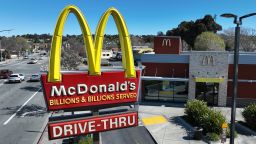 In an aerial view, a sign is posted in front of a McDonald's restaurant on April 03, 2023 in San Pablo, California.