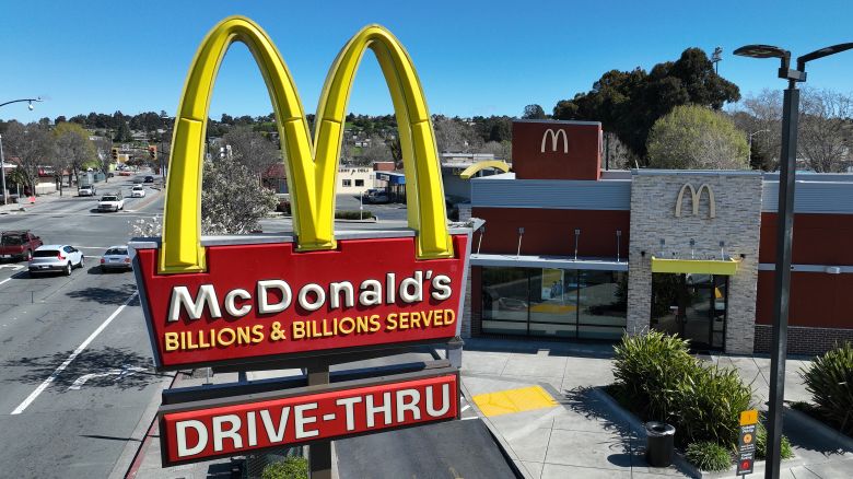 In an aerial view, a sign is posted in front of a McDonald's restaurant on April 03, 2023 in San Pablo, California.