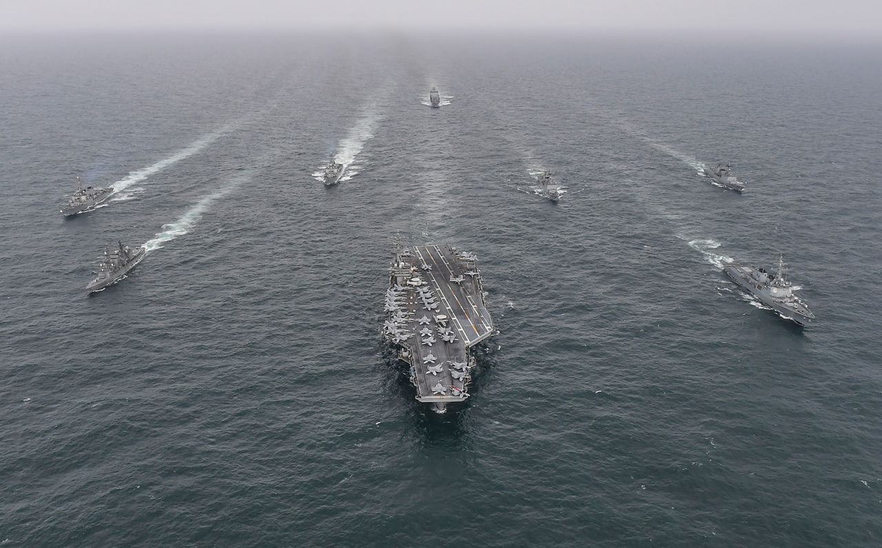 U.S. Navy's aircraft carrier USS Nimitz, centre, is seen during a joint naval exercise in international waters off South Korea's southern island of Jeju on April 4, 2023.