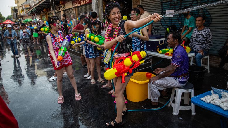 BANGKOK, THAILAND - APRIL 13: Festival goers take part in a massive water gun fight during Songkran on Khaosan Road on April 13, 2023 in Bangkok, Thailand. Songkran, the traditional Thai New Year's Festival, is celebrated each April, Thailand's hottest month of the year. During Songkran, locals and tourists celebrate by partaking in water fights throughout the country. (Photo by Lauren DeCicca/Getty Images)