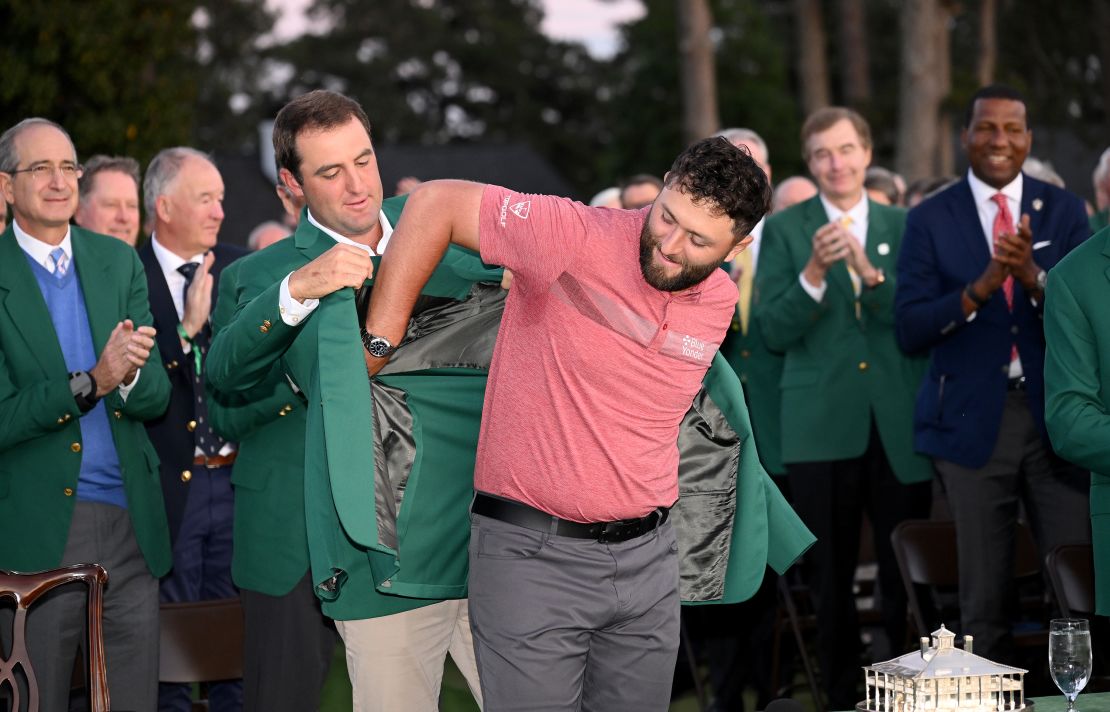 AUGUSTA, GEORGIA - APRIL 09: Jon Rahm of Spain is awarded the Green Jacket by 2022 Masters champion Scottie Scheffler of the United States during the Green Jacket Ceremony after winning the 2023 Masters Tournament at Augusta National Golf Club on April 09, 2023 in Augusta, Georgia. (Photo by Ross Kinnaird/Getty Images)