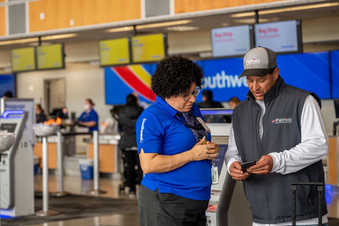 A Southwest Airlines employee assists a passenger during check-in at the Austin-Bergstrom International Airport in Texas.