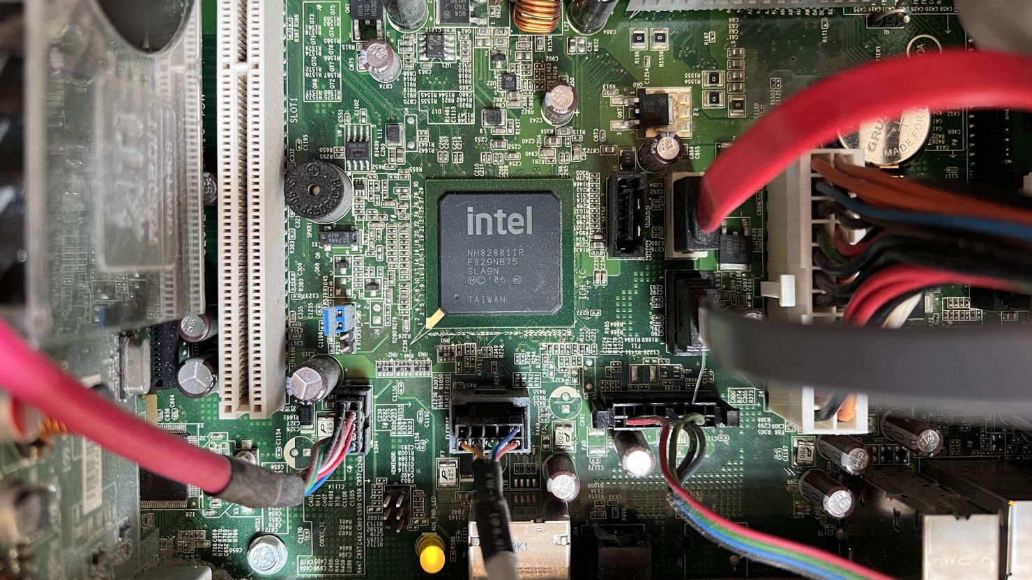 An Intel silicon CPU Taiwanese microprocessor chip is seen at the center of a motherboard circuitboard in Munich, Germany, in April 2023.