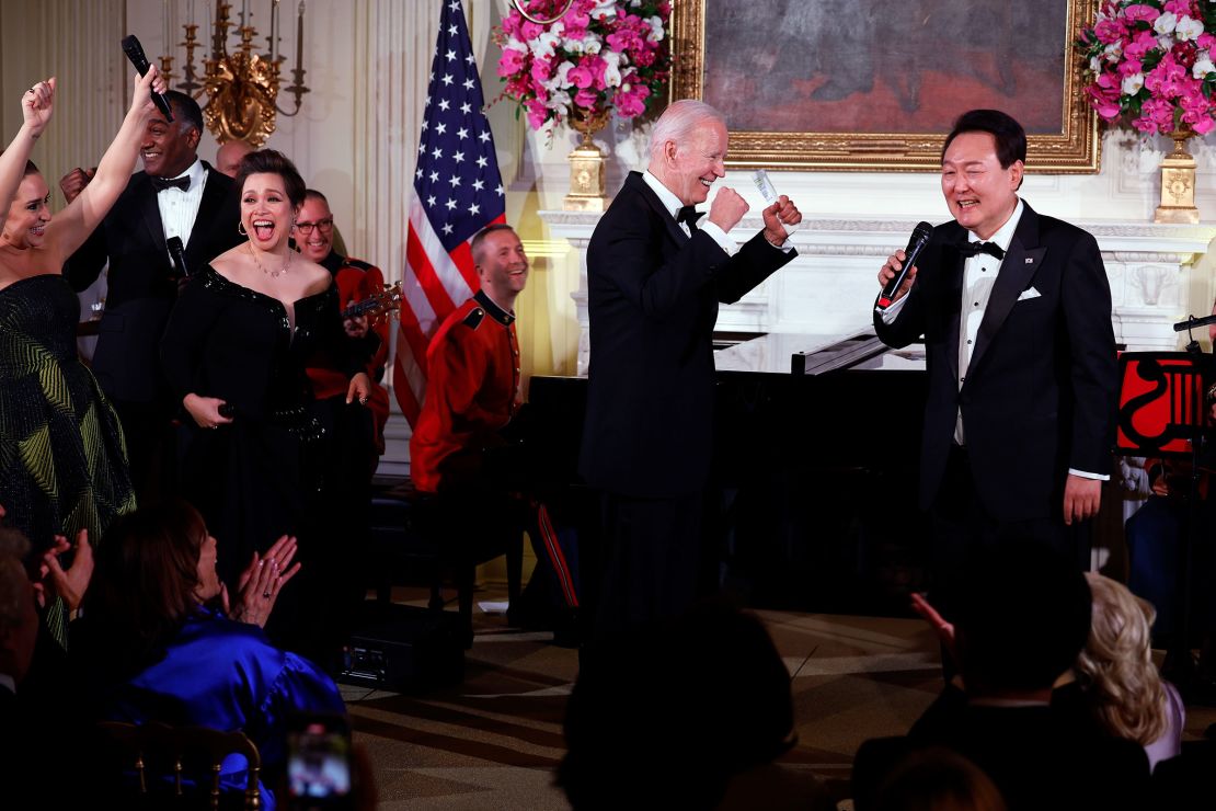 President Joe Biden cheers as South Korean President Yoon Suk Yeol sings "American Pie" by Don McLean during a state dinner at the White House, April 26, 2023 in Washington, DC.