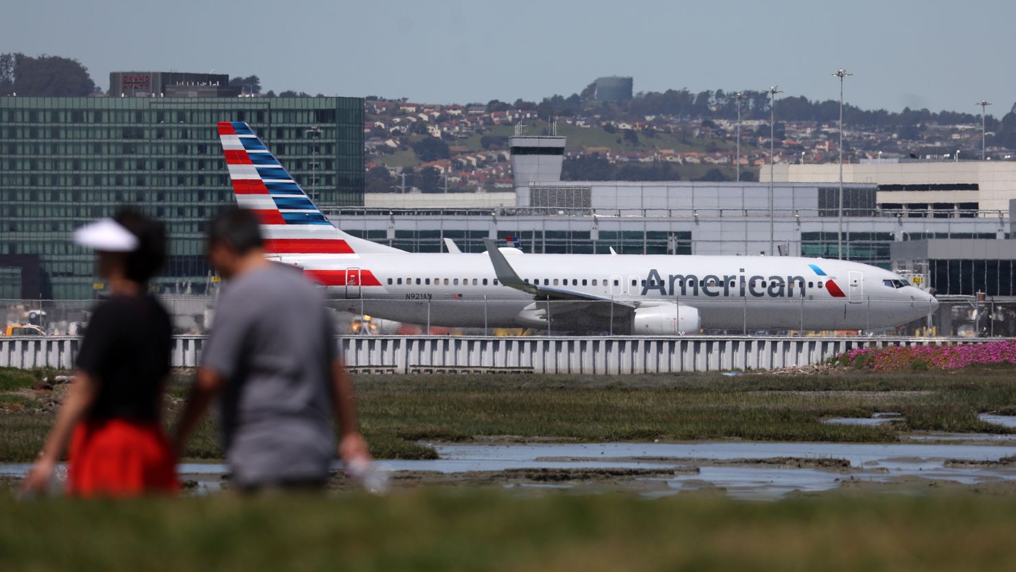 An American Airlines jet taxis on the runway at San Francisco International Airport on April 27, 2023 in San Francisco, California. The Association of Professional Flight Attendants have voted to ratify a new contract with the airline company.