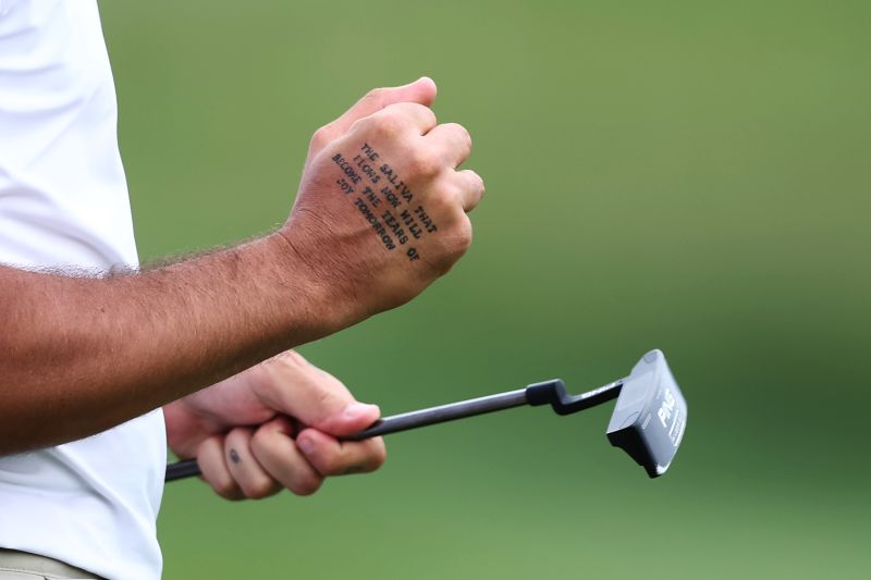 A detail view of a tattoo on the hand of Matthieu Pavon of France reading 