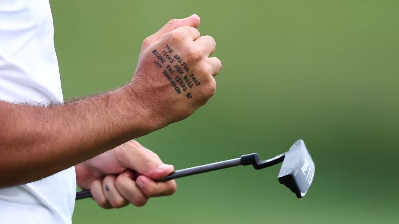 A detail view of a tattoo on the hand of Matthieu Pavon of France reading "The Saliva That Flows Now Will Become the Tears of Joy Tomorrow" during Day One of the DS Automobiles Italian Open at Marco Simone Golf Club on May 04, 2023 in Italy.