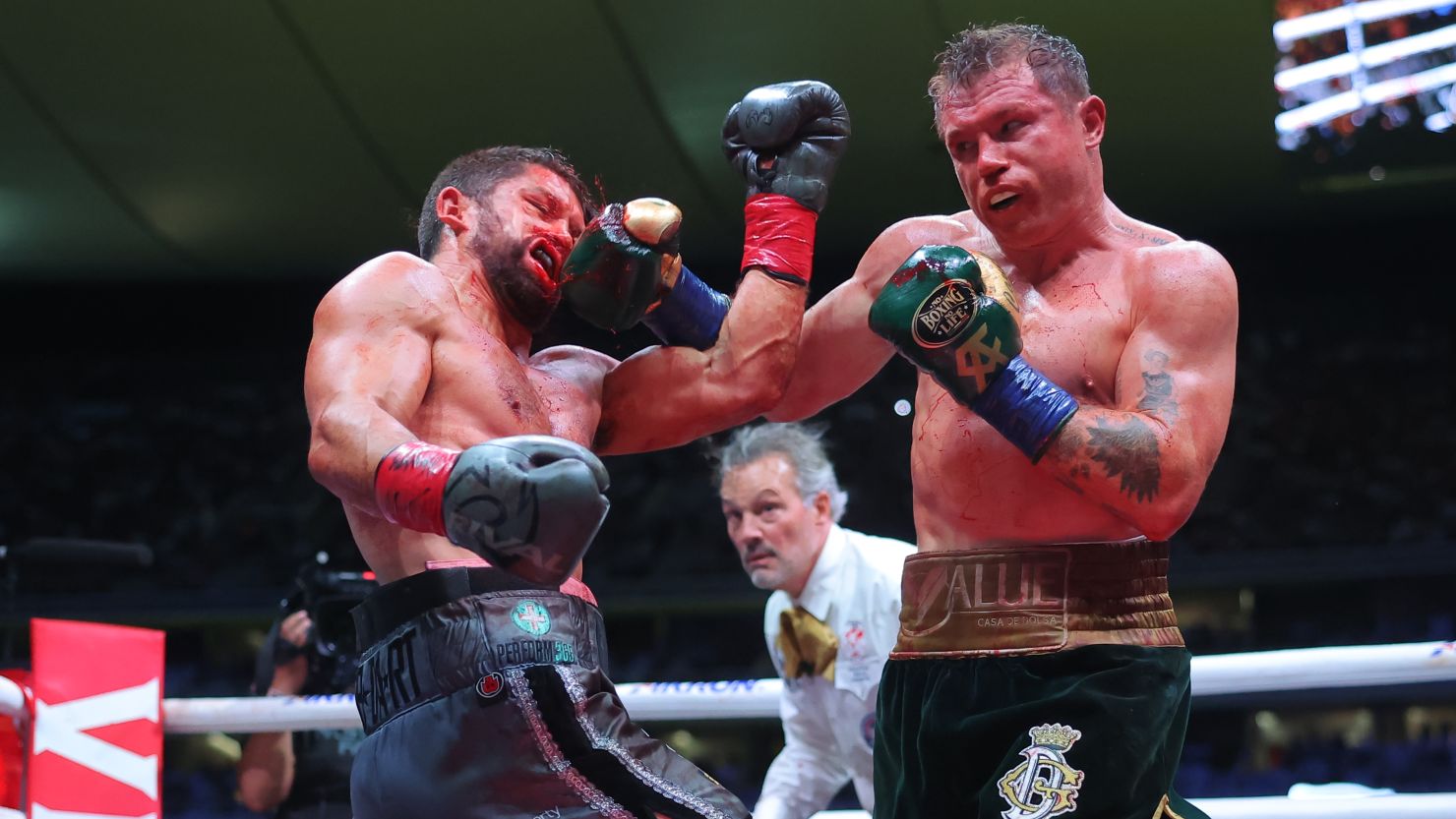 Mexican Álvarez punches Briton John Ryder during their super middleweight title fight at Akron Stadium on May 6, 2023 in Zapopan, Mexico.