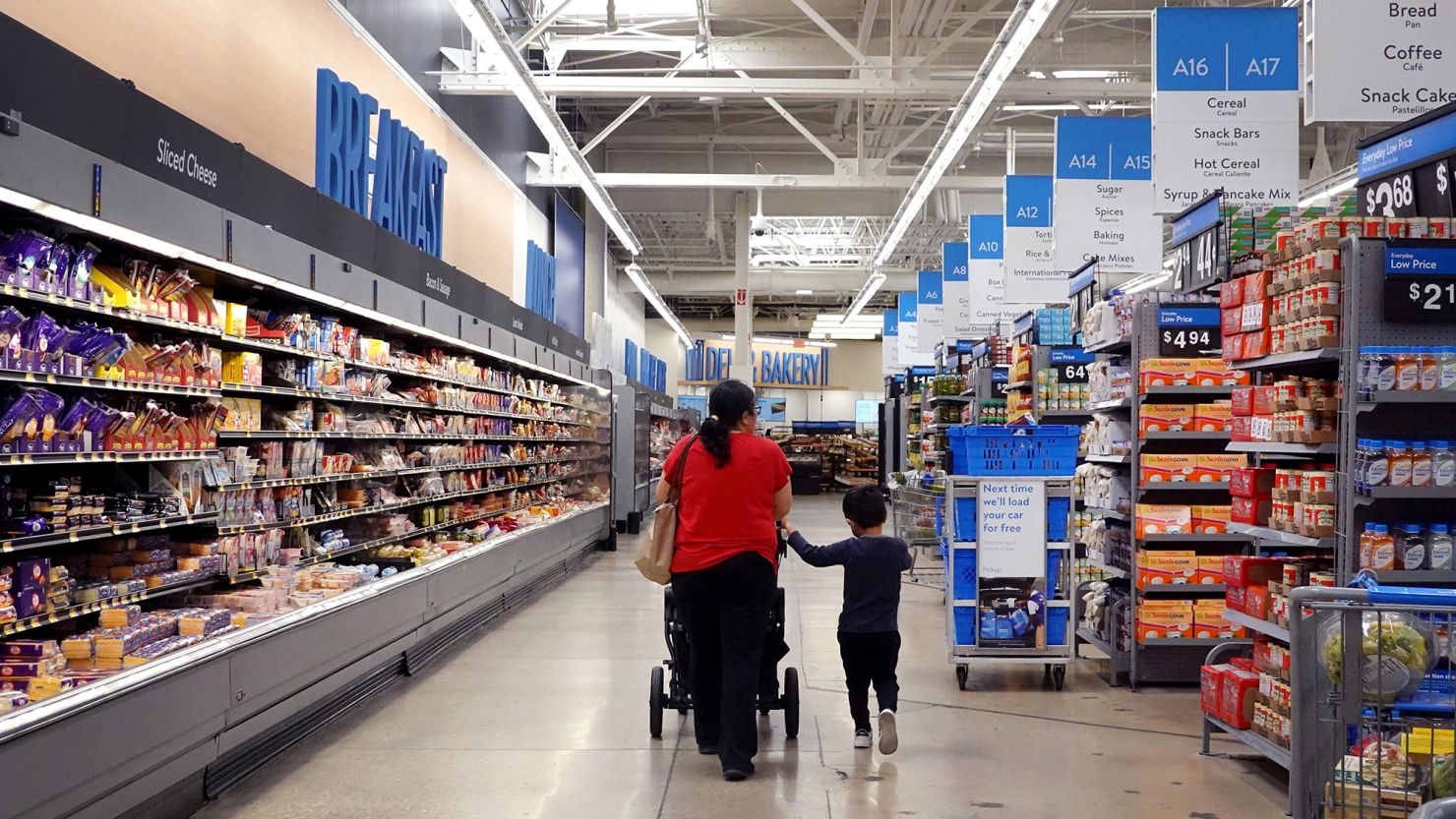 Customers shop at a Walmart store on May 18, 2023 in Chicago, Illinois.