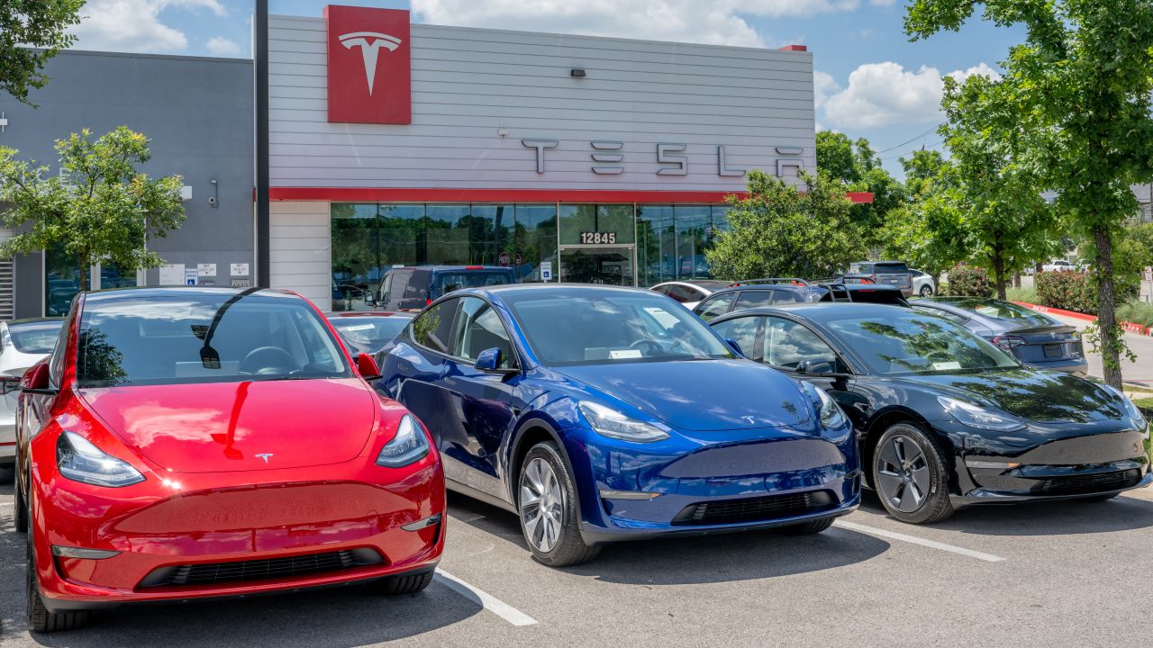 Tesla Model Y vehicles sit on the lot for sale at a Tesla car dealership on May 31, 2023 in Austin, Texas.