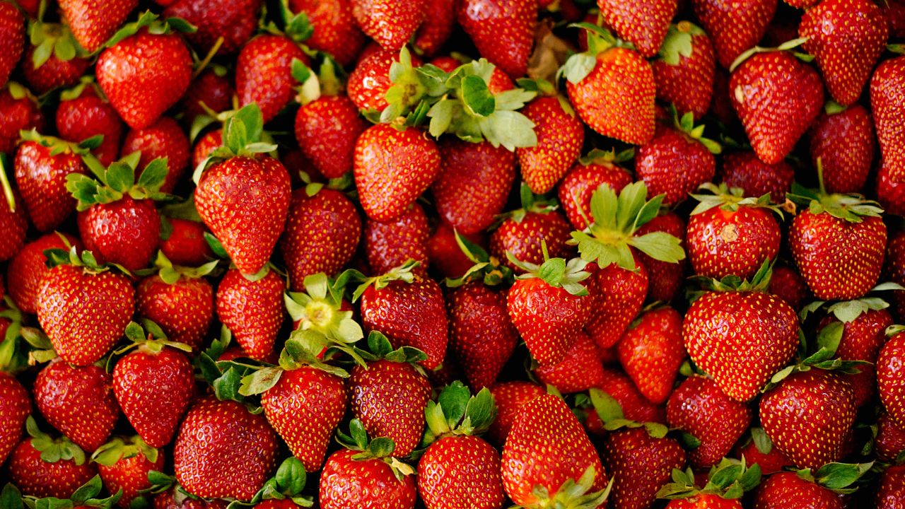 Lots of fresh strawberries sold in the market
