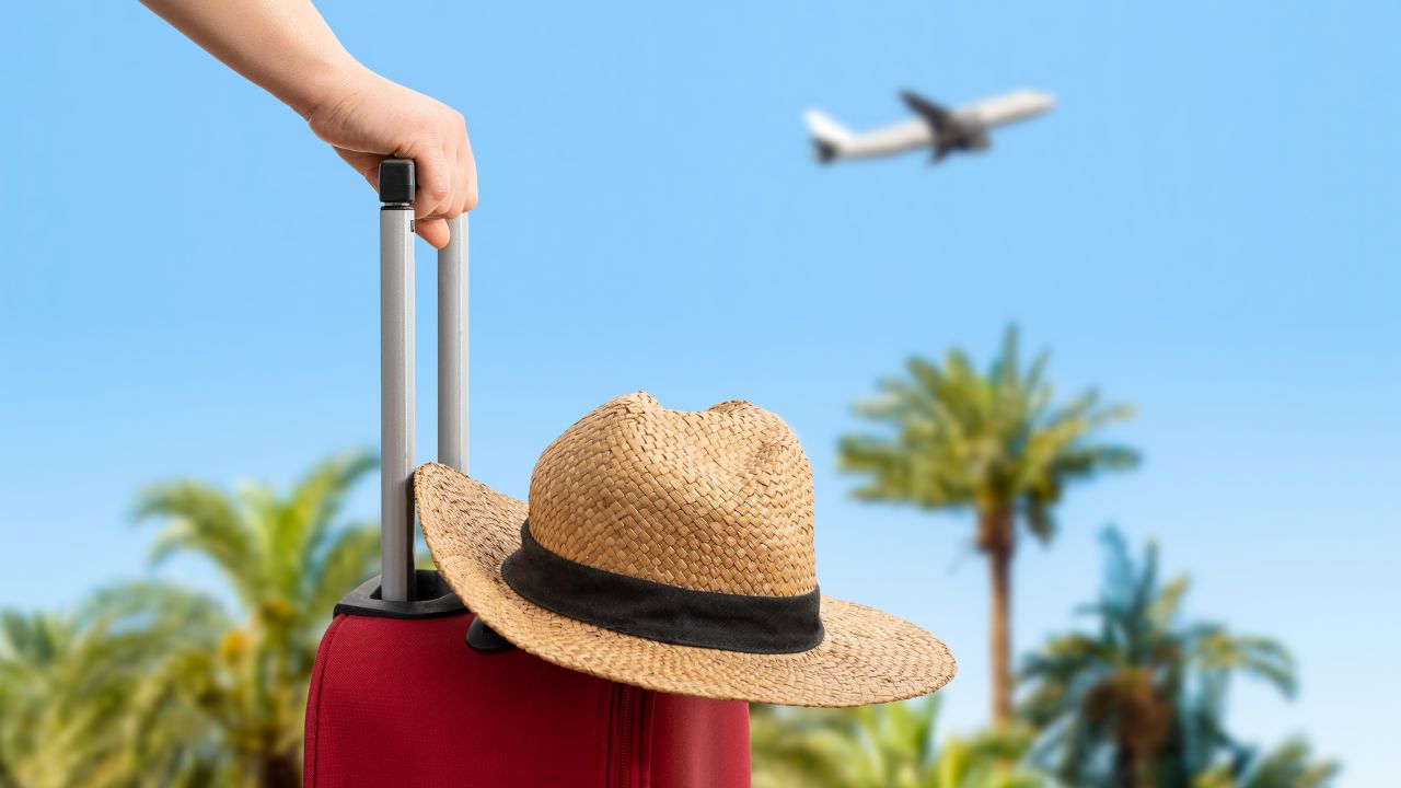 A traveler watches a plane take off.