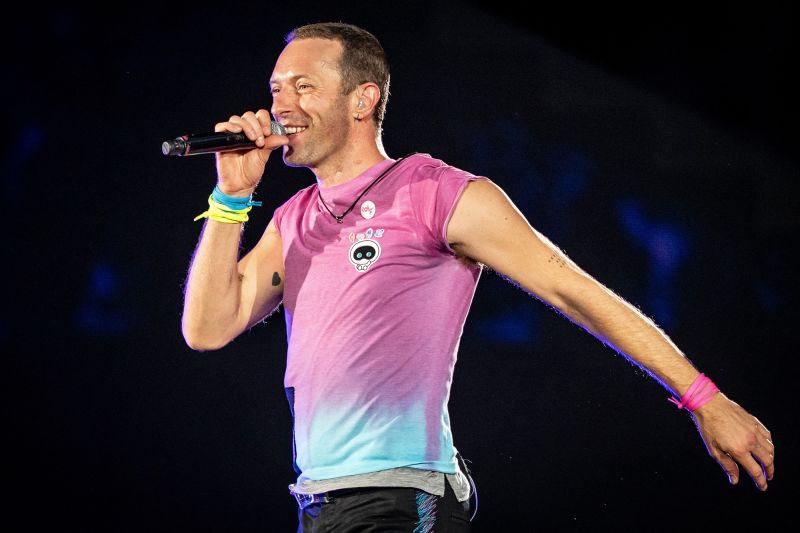 British singer Chris Martin of British band Coldplay performs at Parken Stadium in Copenhagen, on July 5, 2023. The concert is part of the Music of the Spheres World Tour.