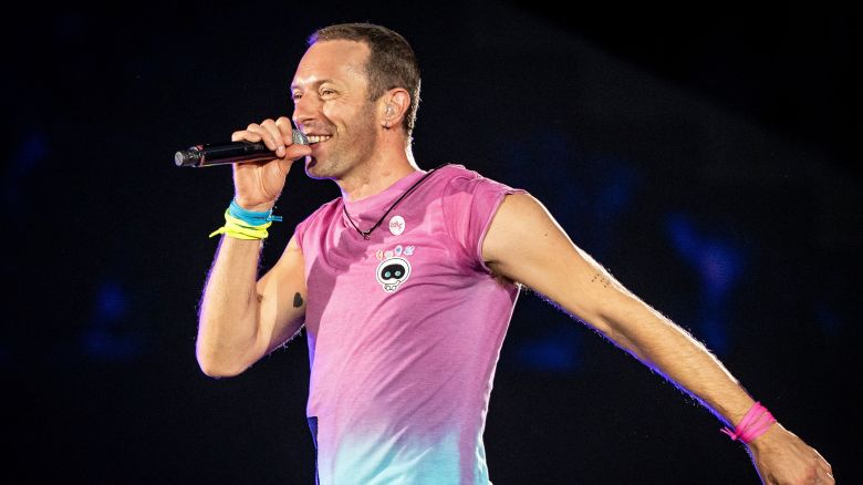 British singer Chris Martin of British band Coldplay performs at Parken Stadium in Copenhagen, on July 5, 2023. The concert is part of the Music of the Spheres World Tour.