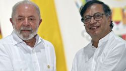 Brazilian President Luiz Inacio Lula da Silva (L) and Colombian President Gustavo Petro shake hands during a meeting for talks on the protection of the Amazon Forest, in Leticia, Colombia, on the border with Brazil, on July 8, 2023. (Photo by Juan BARRETO / AFP) (Photo by JUAN BARRETO/AFP via Getty Images)