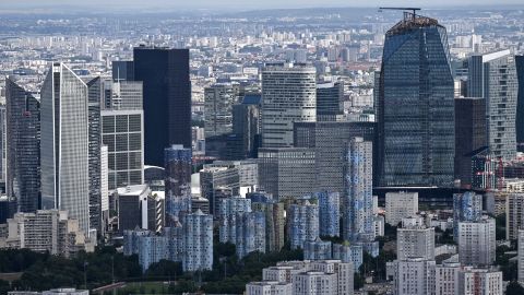 This aerial view shows the La Defense business district and the Aillaud Towers of the Pablo Picasso area of Nanterre, north-west of Paris on July 11, 2023.