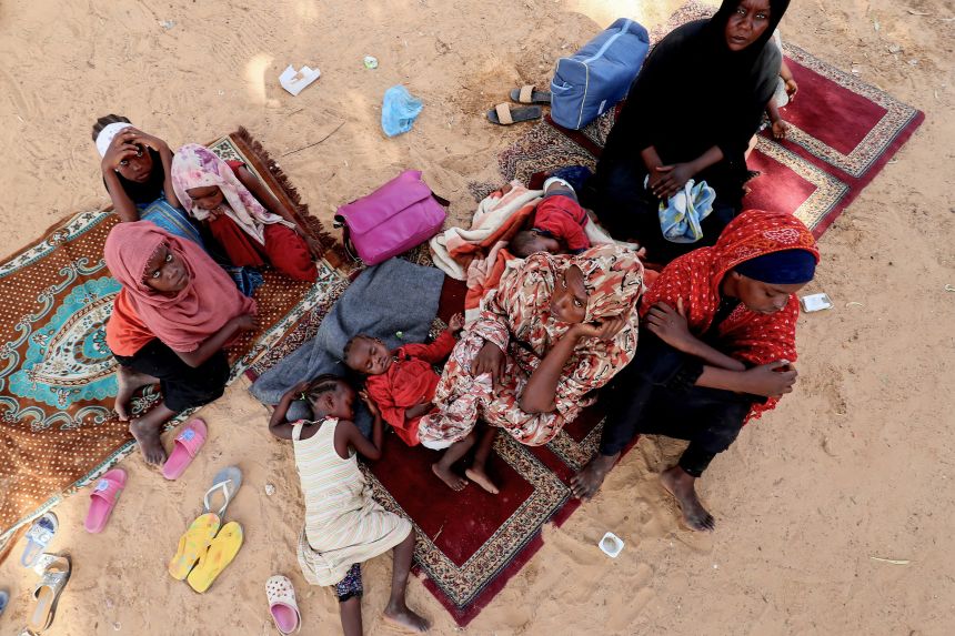 Refugees from Sudan hold a sit-in seeking support in front of UNHCR offices in Tripoli, on July 15, 2023.