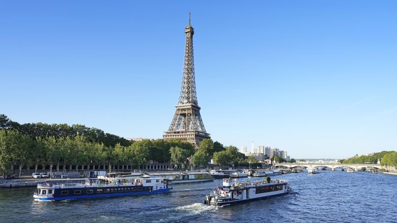 Boats cruise on the River Seine on July 17, 2023, during a test for the 2024 Paris Olympics opening ceremony.
