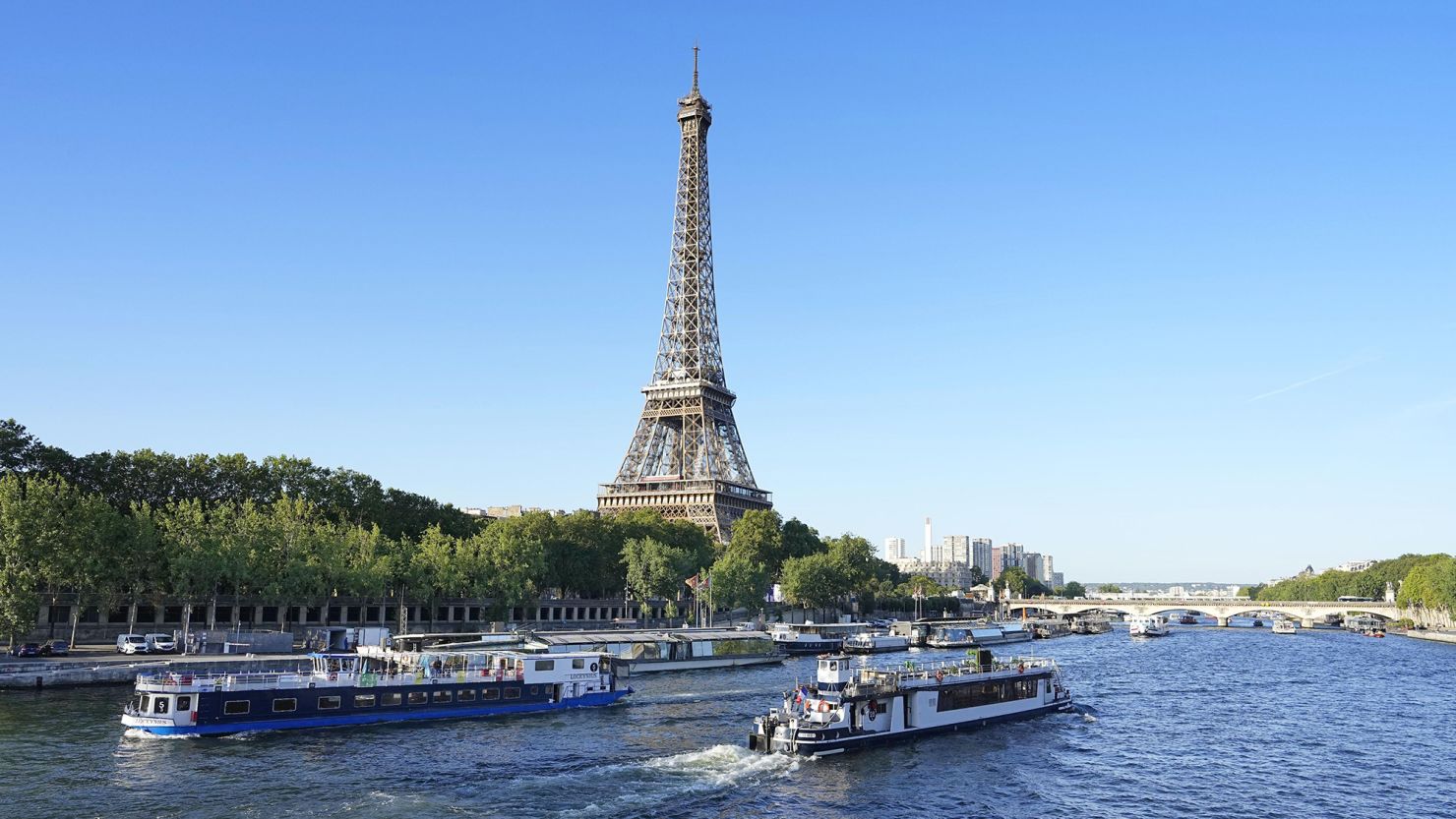 Boats cruise on the River Seine on July 17, 2023, during a test for the 2024 Paris Olympics Opening Ceremony.