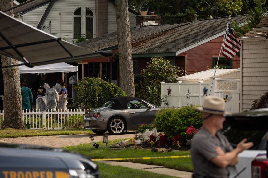 Crime laboratory officers search the New York home of Gilgo Beach murders suspect Rex Heuermann in 2023.