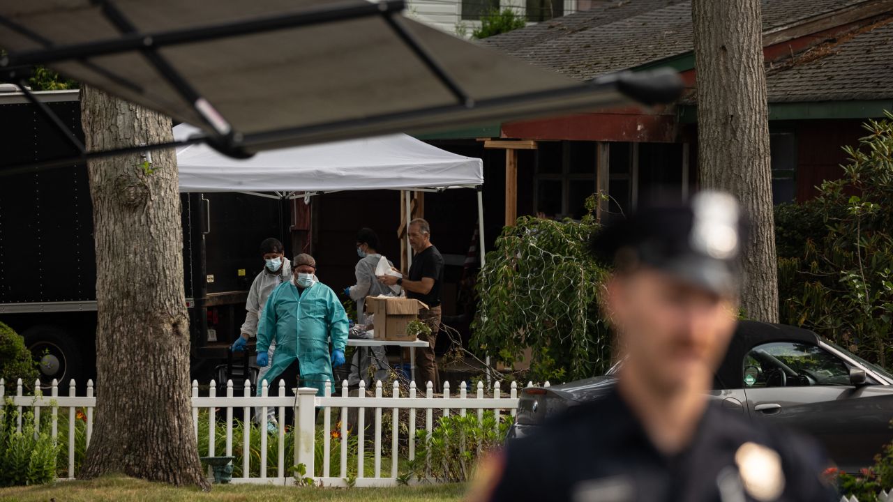 Crime laboratory officers search the home of Gilgo Beach murders suspect Rex Heuermann in Massapequa Park, New York, on July 18, 2023.