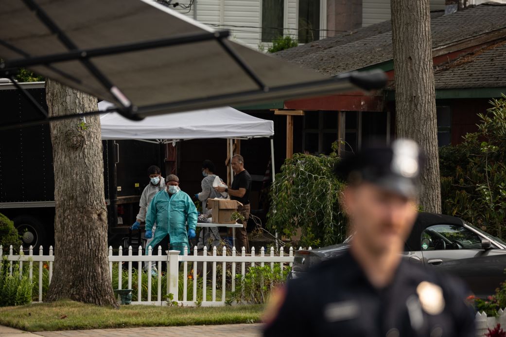 Crime laboratory officers search the home of Gilgo Beach killings suspect Rex Heuermann in Massapequa Park, New York, on July 18, 2023.