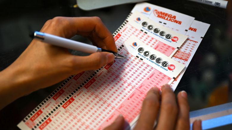 A person plays lottery at a store as US Powerball jackpot grand prize grew to a whopping $1 billion after no ticket got all six numbers in San Mateo, California, United States on July 18, 2023.