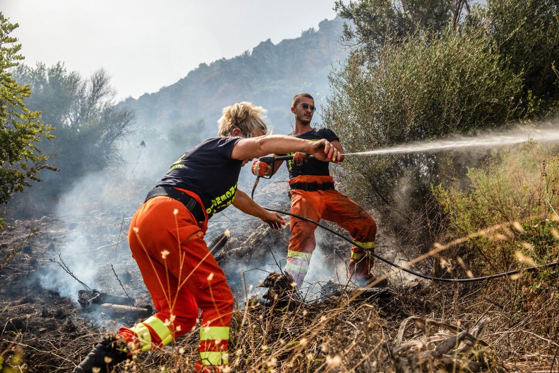 Forest guards contain the fire near Palermo, Sicily, in 2023.