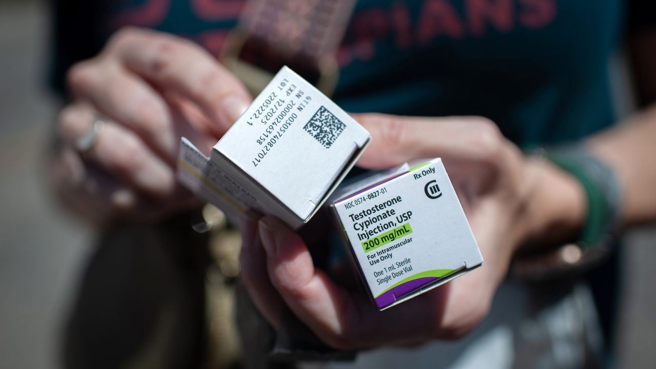 THOMASVILLE, AL - MAY 4: Katie holds Raymond's testosterone supply after successfully filling his prescription at Walgreens in Thomasville, Ala. on May 4, 2023. (Photo by Rory Doyle for The Washington Post via Getty Images)